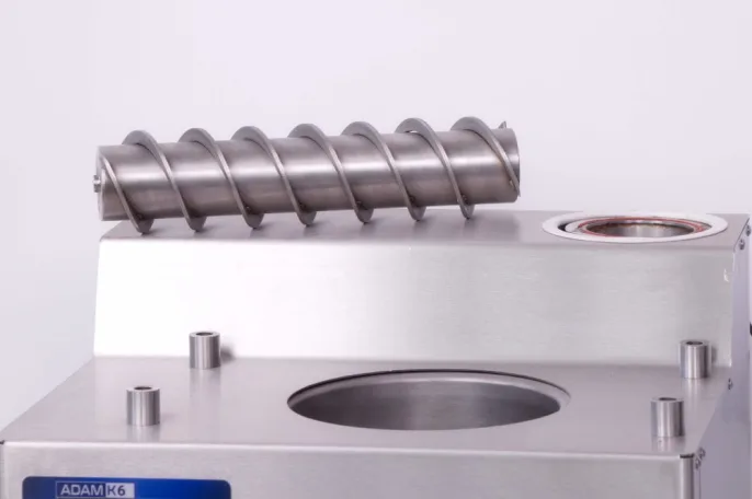 removable auger screw from the Bilait Adam K6 chocolate tempering machine used for chocolate circulation