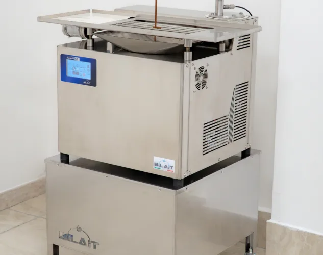 Bilait Adam K6 chocolate tempering machine installed on optional mobile trolley stand